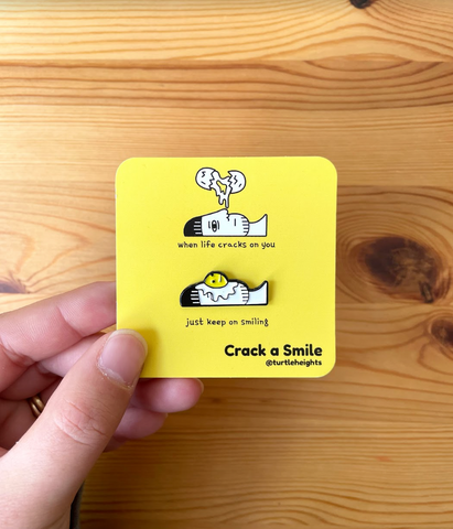 Crack a Smile enamel pin
